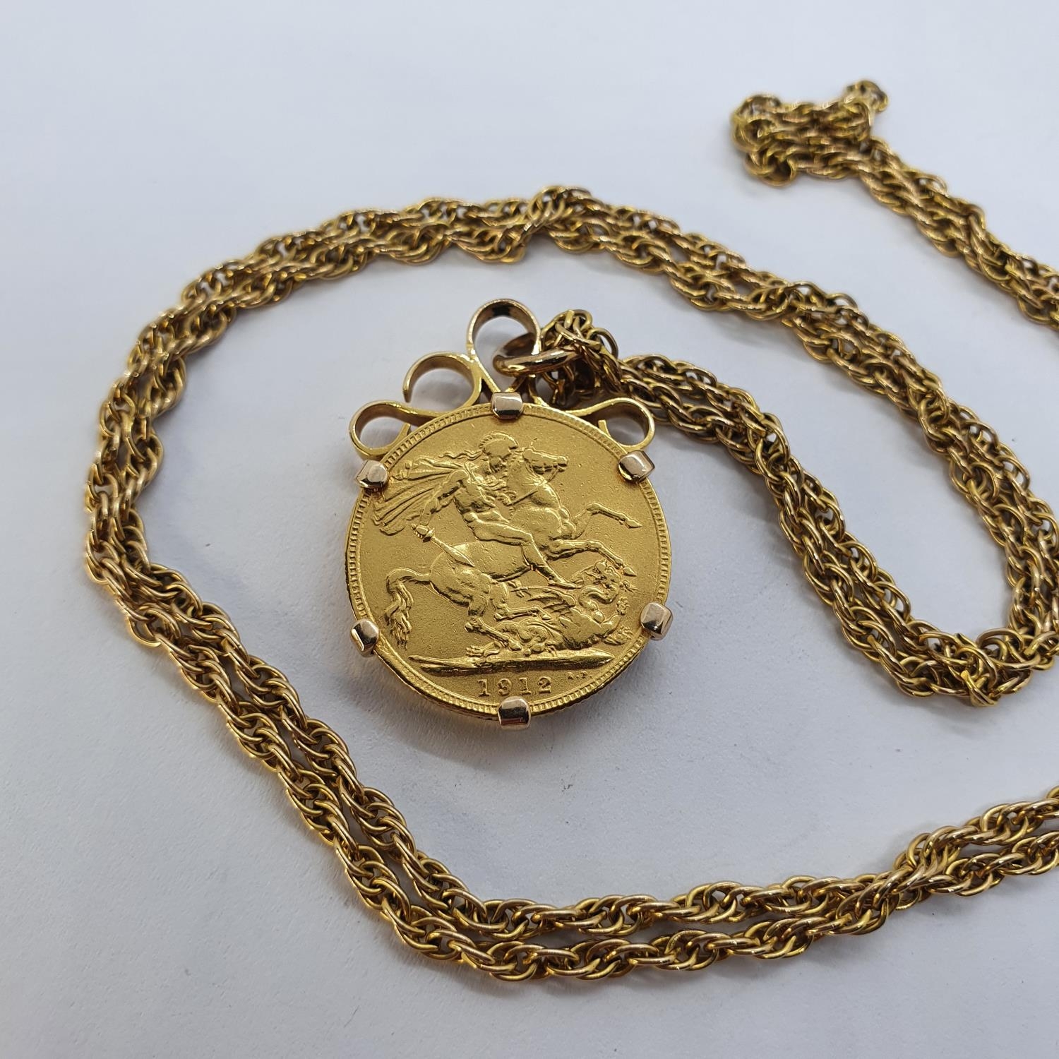 A George V sovereign, 1912, mounted as a pendant, on a chain