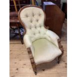 A 19th century mahogany button back armchair