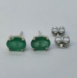 A pair of emerald stud earrings