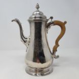 A George II silver coffee pot, with a carved wooden handle, London 1757, 26.6 ozt (all in) Marks