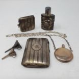 A silver vesta case, initialed, a similar cigarette case, two scent flasks and two silver funnels (