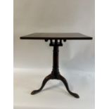 A George III mahogany tripod table, on a birdcage support, 61 cm wide