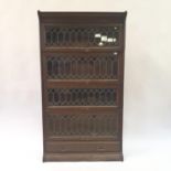 A Globe Wernicke four section bookcase, with leaded glazed doors, 87 cm wide