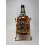 A 3.78 litre bottle of Chivas Regal whisky, in a metal cradle, with cardboard box