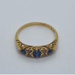 An 18ct gold, sapphire and diamond ring, ring size M