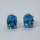 A pair of blue topaz stud earrings