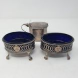 A pair of George III oval silver salts, with blue glass liners, London, date mark rubbed, and a