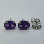 A pair of amethyst stud earrings