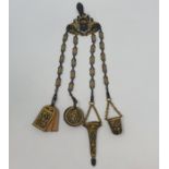 An early 20th century cast and gilt metal chatelaine