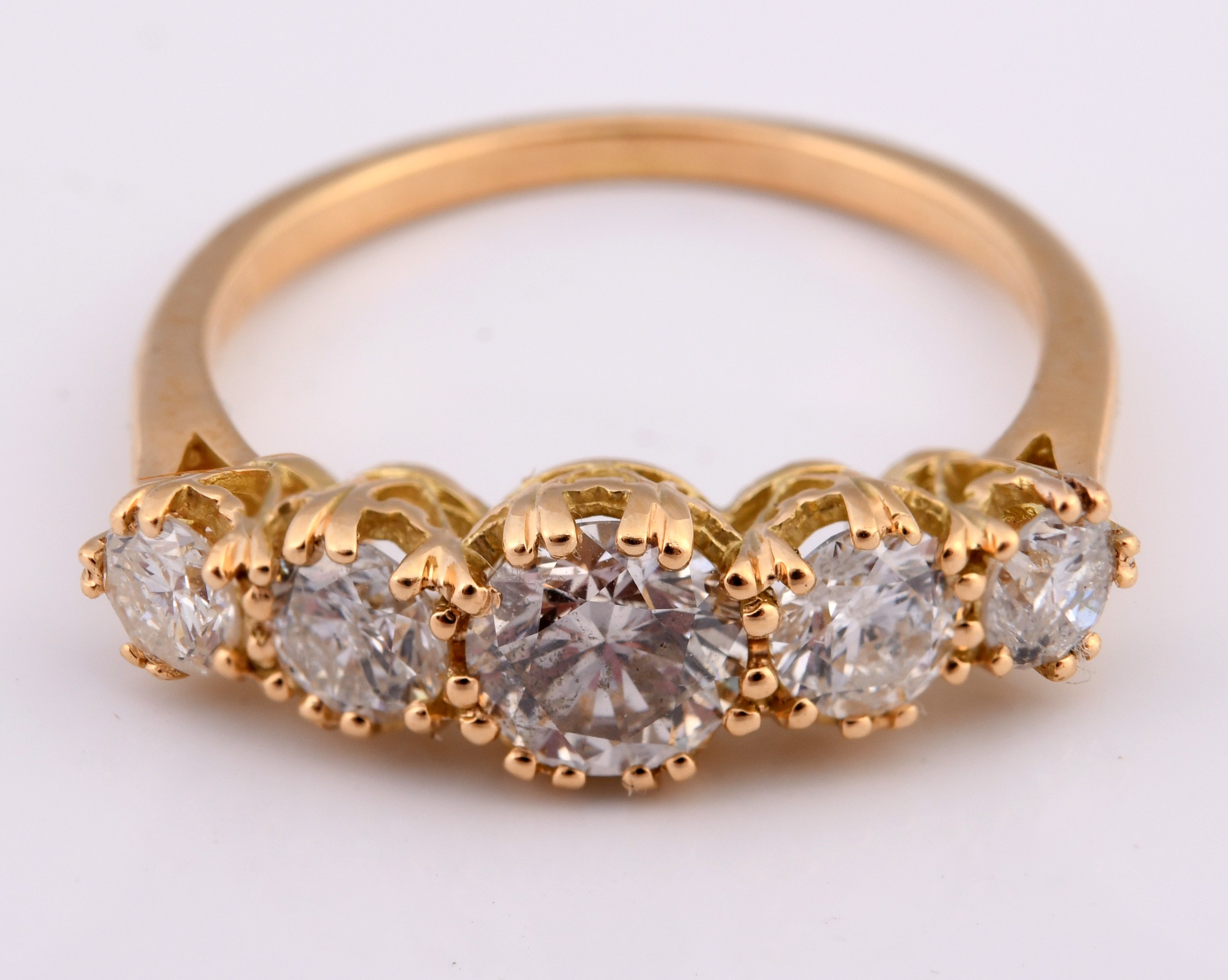 An 18ct gold and five stone diamond ring, ring size K Diamond weight 1.59ct approx. with the