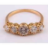 An 18ct gold and five stone diamond ring, ring size K Diamond weight 1.59ct approx. with the