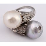 A white coloured metal, diamond and cultured pearl crossover ring, ring size J