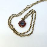 A pendant, on a yellow metal mount and yellow metal chain All in weight, 12.3 g, untested Stone