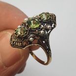 A 9ct gold, peridot and pearl ring Ring size Q1/2