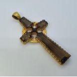 A large 15ct gold and smoky quartz cross, 9 cm long