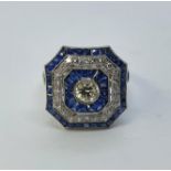 An art deco style platinum sapphire and diamond cluster ring, ring size L 1/2 Diamond weight 1.