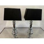 A pair of chrome table lamps, by Andrew Martin, 47 cm high (2) The wire has been cut off and will