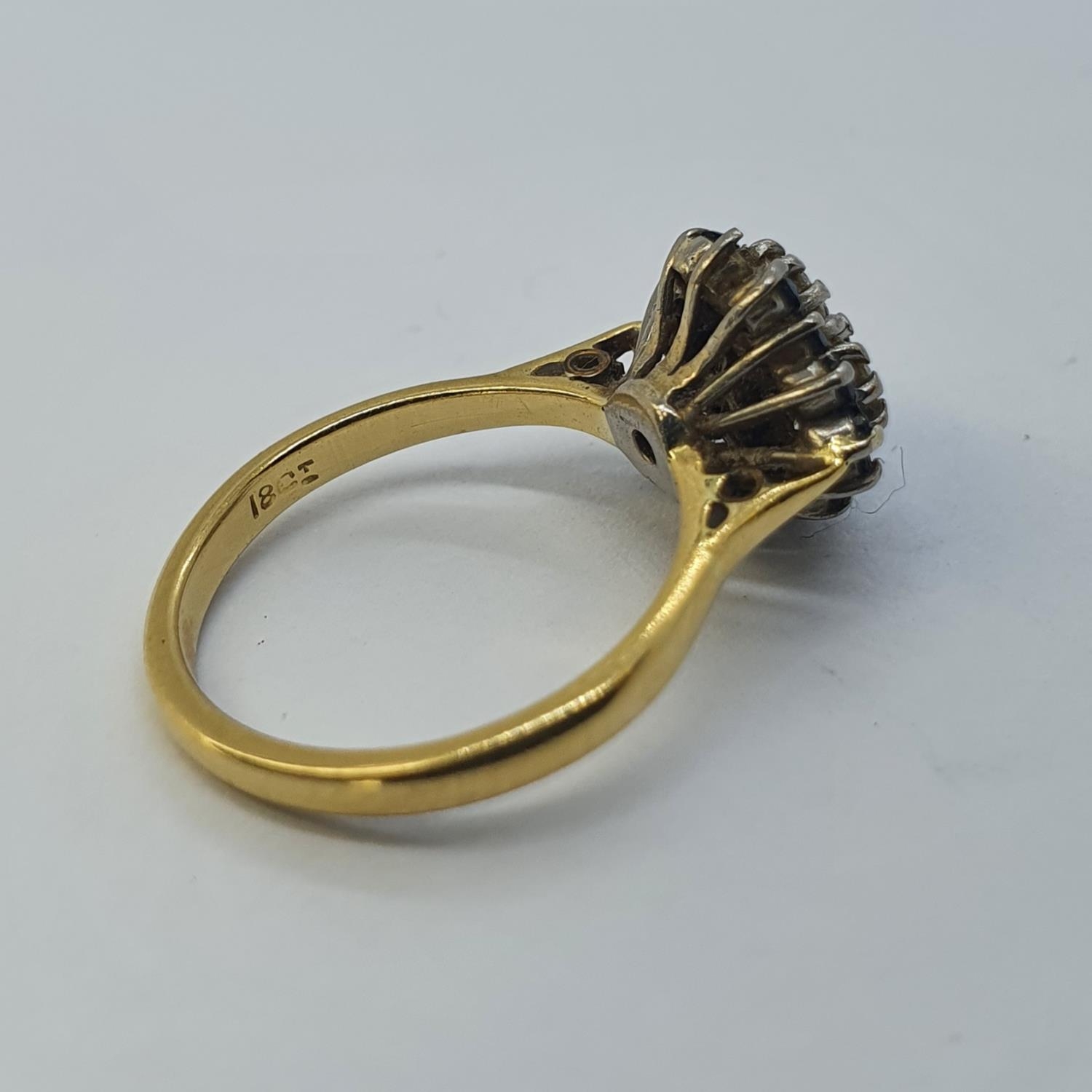 An 18ct gold, sapphire and diamond cluster ring, ring size G 1/2 all in weight 4.3 g - Image 2 of 2
