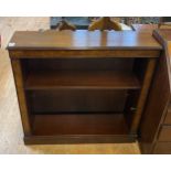 A mahogany bookcase, a pedestal desk, two wine tables, a bedside mirror, a mahogany commode, a