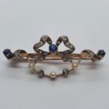A sapphire, diamond and pearl brooch On yellow coloured metal and tested