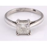 An 18ct white gold and solitaire princess cut diamond ring, ring size L 1/2