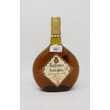 A 70cl bottle of Belle Vue Armagnac, a 350ml bottle of Remy Martin cognac, and a 70cl bottle of