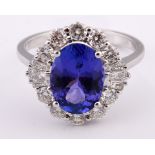 An 18ct white gold, tanzanite and diamond cluster ring Tanzanite weight 3.12ct approx. Diamond