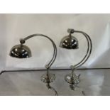 A pair of chrome adjustable table lamps, 52 cm high The wire has been cut off and will need re-