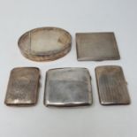 A George V silver cigarette case, Birmingham 1922, three cigarette cases and a silver coloured metal