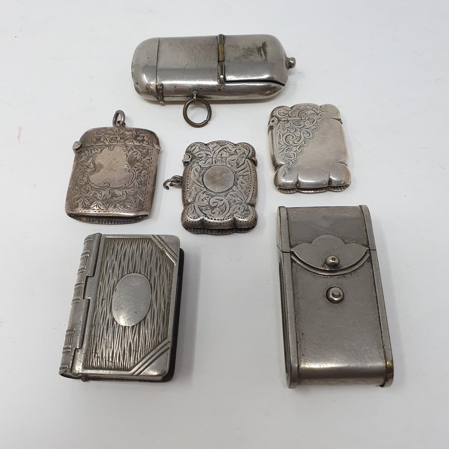 A George V vesta, Birmingham 1912, two silver vestas and three silver plated vestas (6)