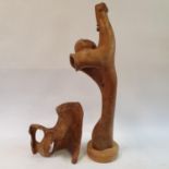 A carved wood modern art sculpture of a fist, 141 cm high and another, 50 cm high (2)