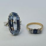 An 18ct white gold and blue stone ring, ring size L and a 18ct gold, sapphire and diamond ring, ring