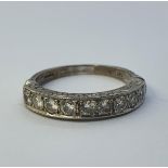 An 18ct white gold and half hoop ring, ring size M probably made from a full eternity ring can not