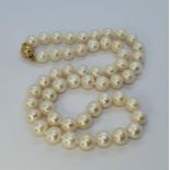 A cultured pearl necklace, with a 9ct gold ball clasp