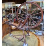 A 19th century walnut spinning wheel, 95 cm high