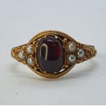 A 15ct gold, garnet and pearl ring, ring size N