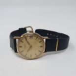 A gentleman's Longines wristwatch, with a leather strap Yellow metal case untested, light