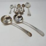 A pair of George III old English pattern sauce ladles, seven silver spoons, various dates and marks,