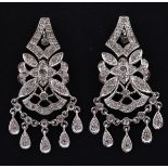 An Art Deco style pair of 14ct white gold and diamond set drop earrings (2)