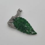 A platinum, jade and diamond brooch, in the form of a leaf No visible faults to naked eye diamond