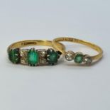 An 18ct gold emerald and diamond ring, ring size O and an emerald and diamond three stone ring, ring