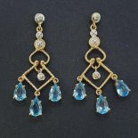 A pair of 9ct gold, diamond and blue topaz earrings