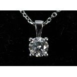 An 18ct white gold and diamond solitaire pendant, on a 18ct white gold chain Diamond 0.52ct