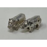 A silver hippo and a rhino (2) This is a modern copy Untested silver coloured metal,