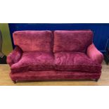A red velvet two seater sofa, 190 cm wide