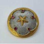 A French 18ct gold, aluminium and ruby brooch
