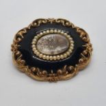 A 19th century yellow coloured metal and jet memorial brooch, engraved verso and dated May 24th 1856