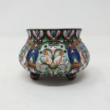 A Russian silver and enamel salt, decorated flowers, 6 cm diameter All in weight 73.6 g, Overall