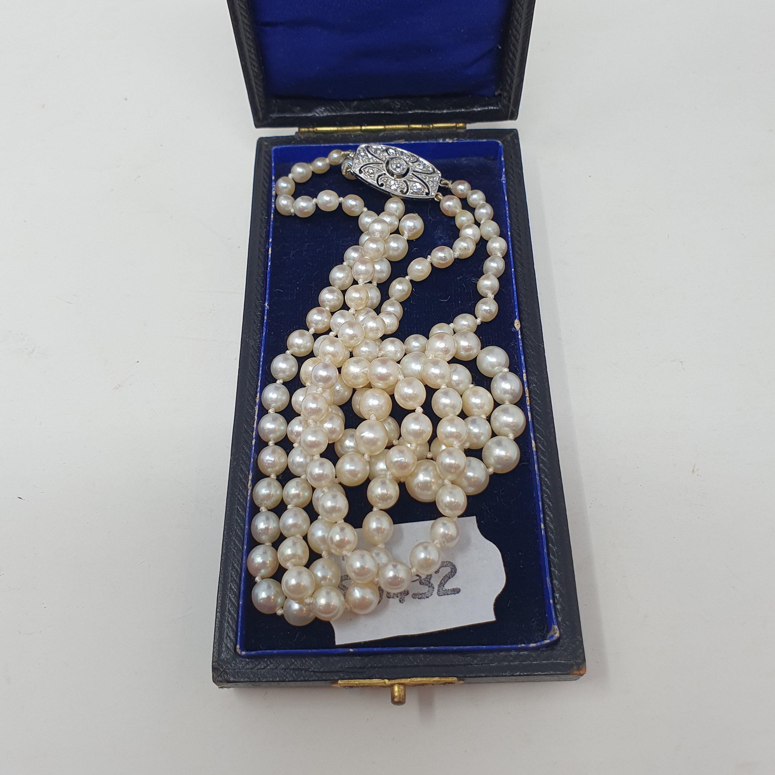 A two row cultured pearl necklace, with a diamond set clasp, boxed One strand broken - Image 2 of 2