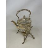 A late 19th/early 20th century silver plated kettle on stand, with burner, 30 cm high light ware